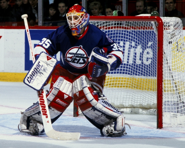 MONTREAL, CANADA - CIRCA 1995:  Nikolai Khabibulin #35 of the Winnipeg Jets follows the action during a game against the Montreal Canadiens Circa 1995 at the Montreal Forum in Montreal, Quebec, Canada. (Photo by Denis Brodeur/NHLI via Getty Images)