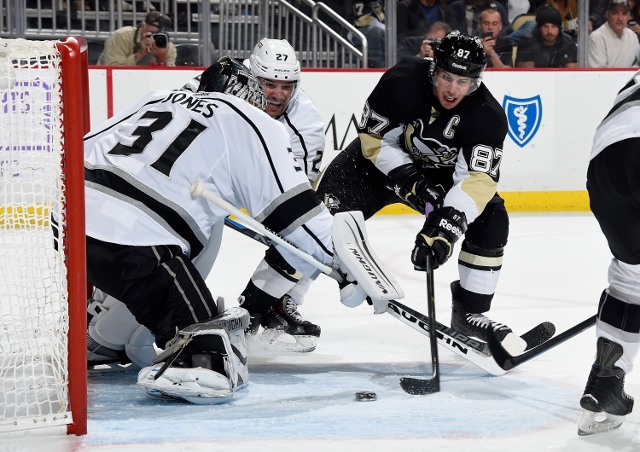 PITTSBURGH, PA - OCTOBER 30:  Marc-Andre Fleury #29 of the Pittsburgh Penguins takes a shot in front of Martin Jones #31 and Alec Martinez #27 of the Los Angeles Kings at Consol Energy Center on October 30, 2014 in Pittsburgh, Pennsylvania.  (Photo by Joe