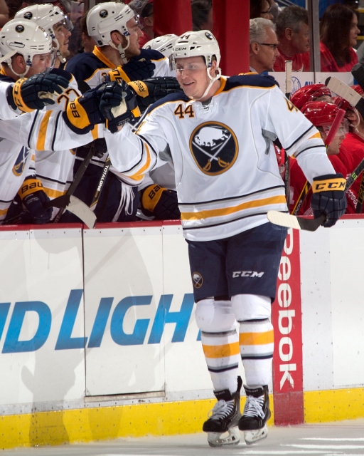 DETROIT, MI - APRIL 4: Nicolas Deslauriers #44 of the Buffalo Sabres celebrates his first NHL goal with teammates on the bench during an NHL game against the Detroit Red Wings on April 4, 2014 at Joe Louis Arena in Detroit, Michigan. Detroit defeated Buff