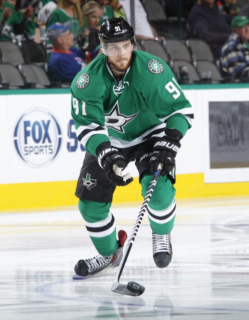 DALLAS, TX - OCTOBER 21: Tyler Seguin #91 of the Dallas Stars handles the puck against the Vancouver Canucks at the American Airlines Center on October 21, 2014 in Dallas, Texas. (Photo by Glenn James/NHLI via Getty Images)