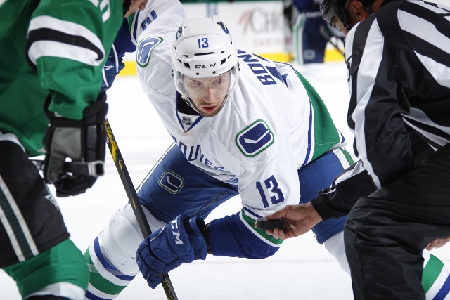 DALLAS, TX - OCTOBER 21: Nick Bonino #13 of the Vancouver Canucks readies for a face off against Cody Eakin #20 of the Dallas Stars at the American Airlines Center on October 21, 2014 in Dallas, Texas. (Photo by Glenn James/NHLI via Getty Images)