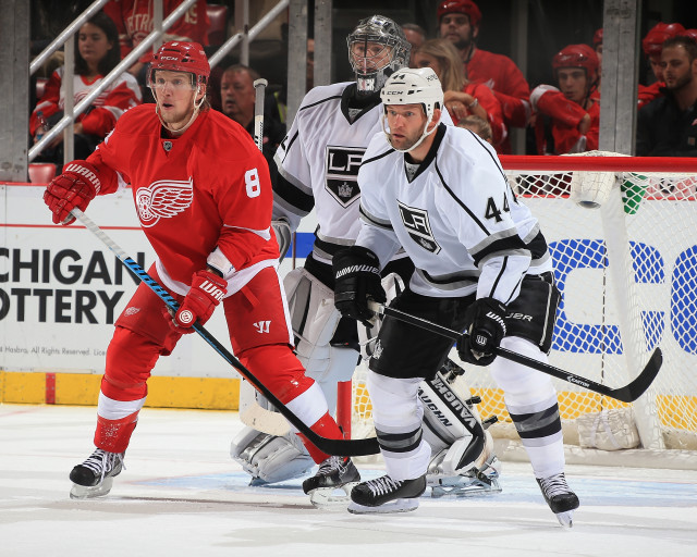 DETROIT, MI - OCTOBER 31: Justin Abdelkader #8 of the Detroit Red Wings sets up in front of Jonathan Quick #32 and Robyn Regehr #44 of the Los Angeles Kings during a NHL game on October 31, 2014 at Joe Louis Arena in Detroit, Michigan. The Wings defeated