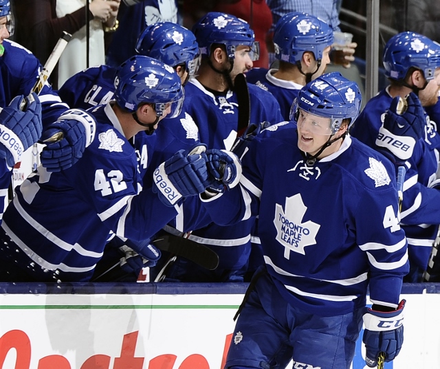 TORONTO, ON - NOVEMBER 12: Morgan Rielly #44 of the Toronto Maple Leafs celebrates his goal against the Boston Bruins during NHL game action November 12, 2014 at the Air Canada Centre in Toronto, Ontario, Canada. (Photo by Graig Abel/NHLI via Getty Images