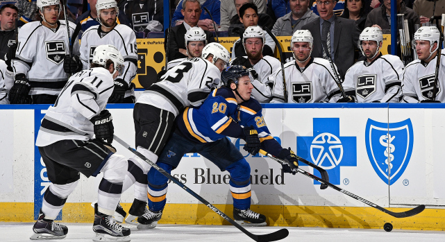 Los Angeles Kings right wing Dustin Brown (23) celebrates with Anze Kopitar  (11) after Brown scored an open net goal against the St. Louis Blues in the  third period of Game 4