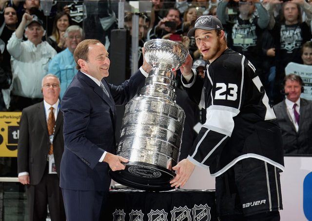Dustin Brown holds up The Stanley Cup at an event where LA Kings News  Photo - Getty Images